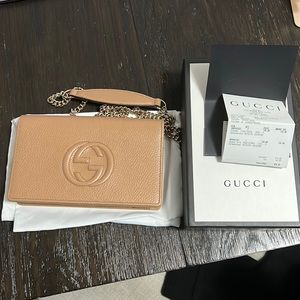 Gucci wallet on a chain.